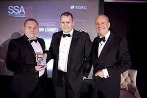 Customers Service Director Matthew Ruddle and CEO James White collecting the award, presented by Gyles Brandreth Customers Service Director Matthew Ruddle and CEO James White collecting the award, presented by Gyles Brandreth